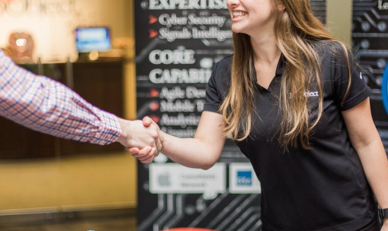 Candidate shaking hands with employer