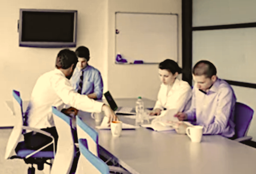 Employees at a study table